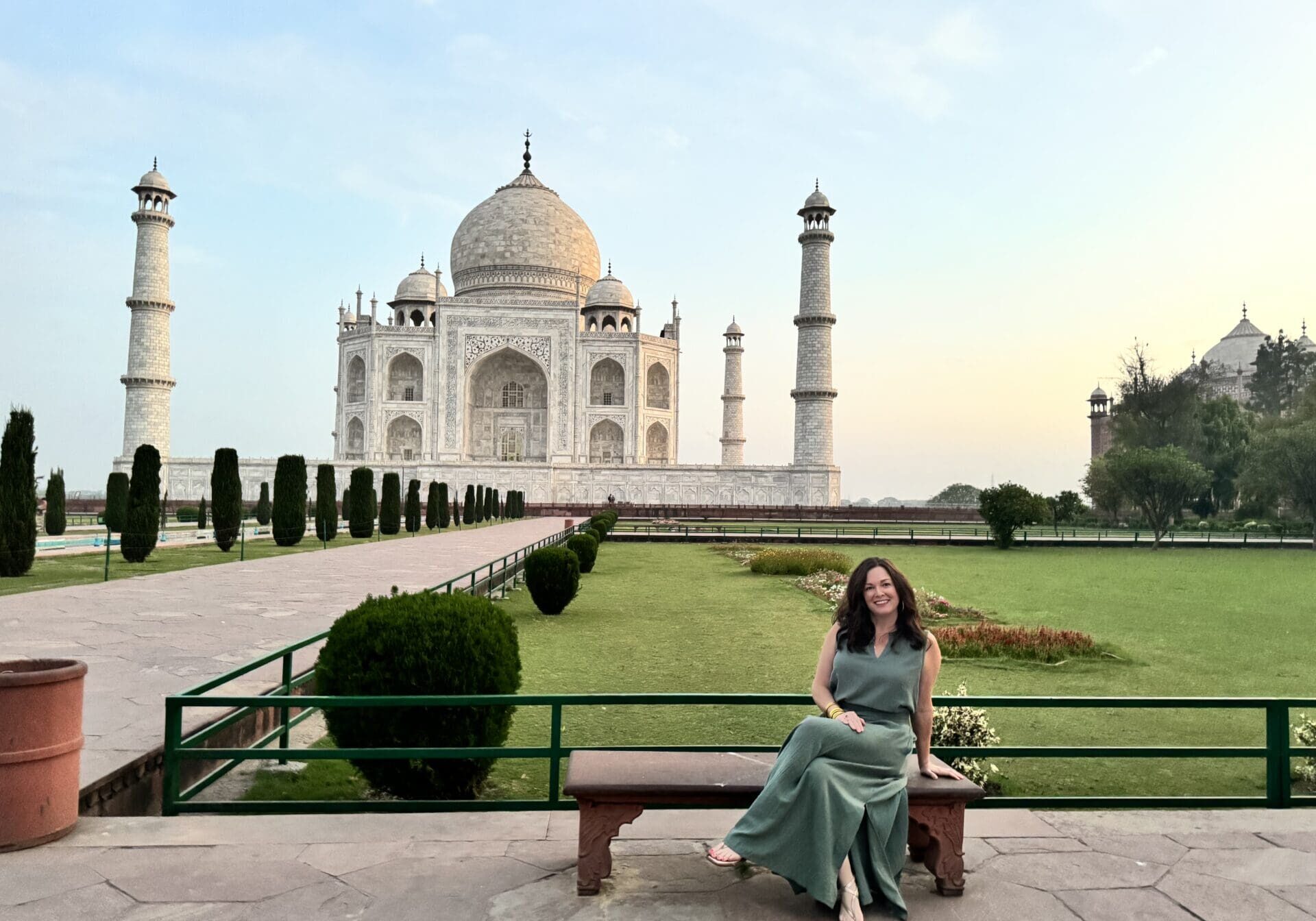 Amy Cochran in front of the Taj Mahal at dawn. A luxury experience arranged by our partners in India. Amy said experiencing this monument at sunrise, with no crowds at all, was surreal and magical.